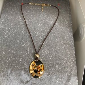 Corded necklace with gold and lacquer pendant